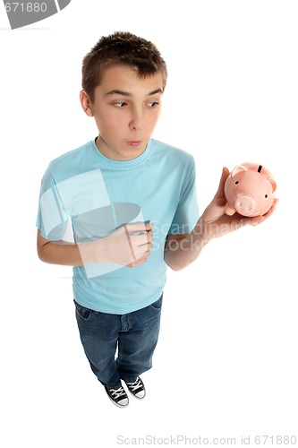 Image of Boy looking at money box