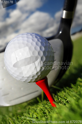 Image of  Golf club and ball in grass