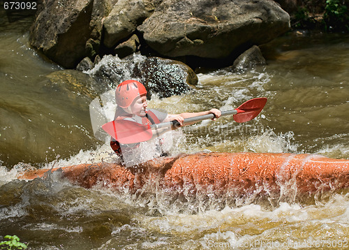 Image of teenage girl white water kayaking