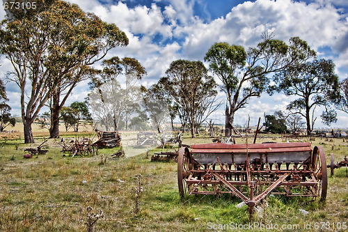 Image of old farm machinery in field