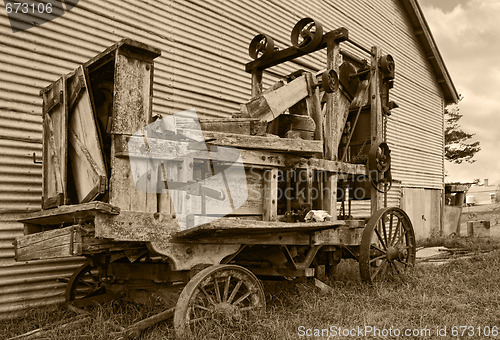 Image of old farm machinery baler