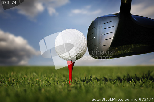 Image of Golf club and ball in grass