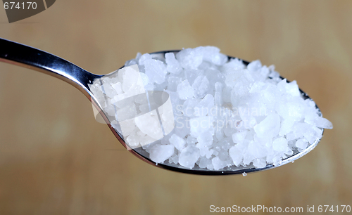 Image of Salt bowl and spoon over brown