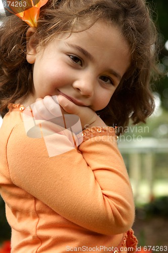 Image of Pretty little girl smiling outdoors