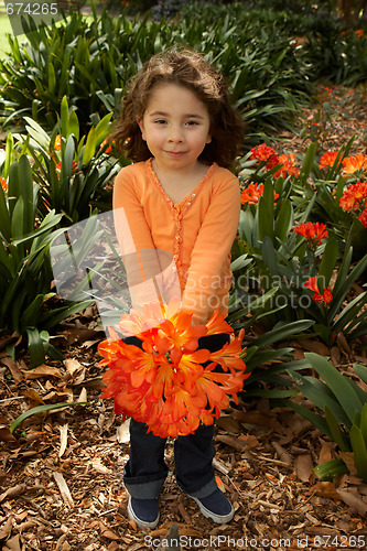 Image of Girll with a bunch of clivia from the garden