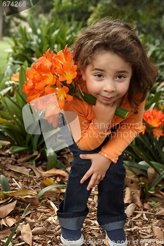 Image of Young girl with a bunch of lilies