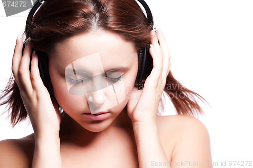 Image of Beautiful woman listening music