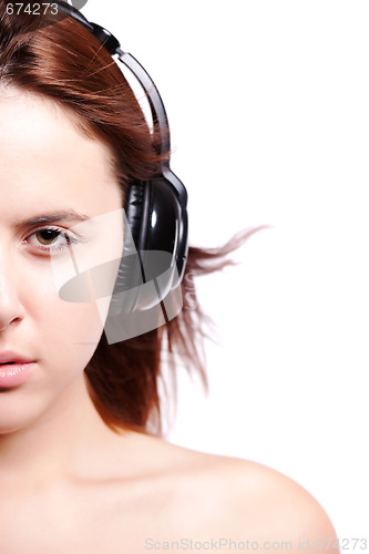 Image of Beautiful woman listening music