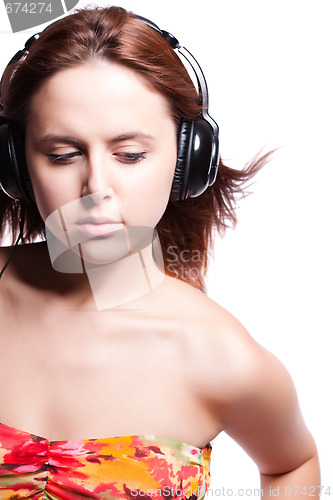 Image of Beautiful woman listening music