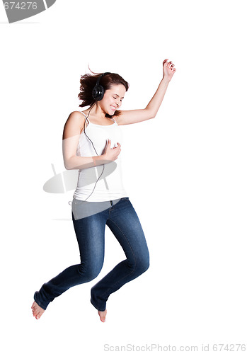 Image of Beautiful woman jumping for joy
