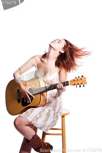 Image of Beautiful woman with guitar