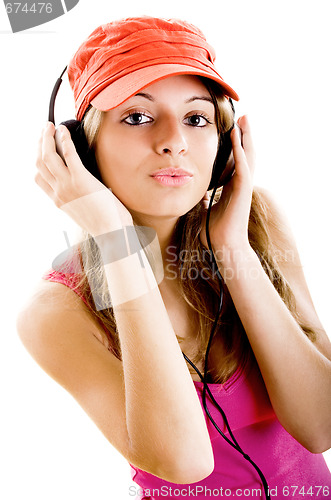 Image of Young woman listen music