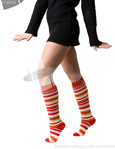 Image of women's legs in stripped long socks