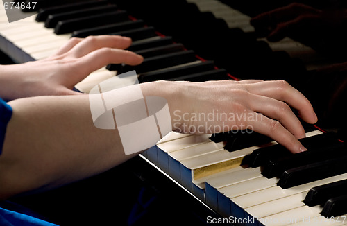 Image of Hands playing piano