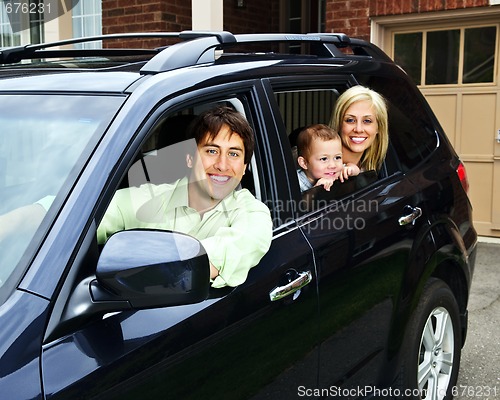 Image of Happy family in car