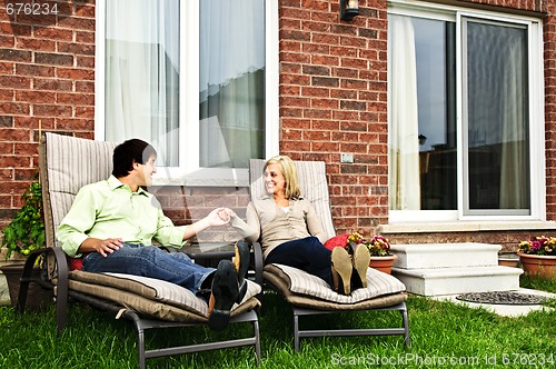 Image of Happy couple relaxing at home