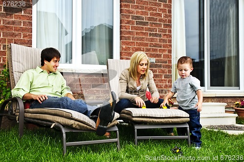 Image of Happy family relaxing at home