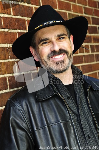 Image of Bearded man in cowboy hat