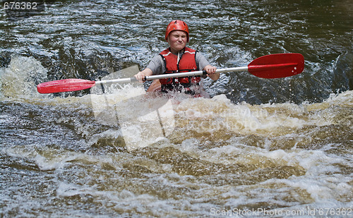 Image of teenage girl white water kayaking