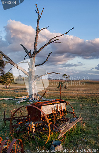 Image of old farm machinery in field