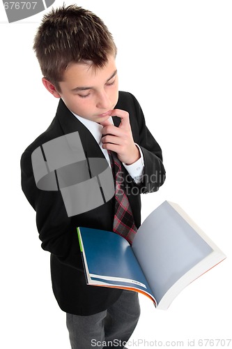 Image of Student pindering thinking with open text book