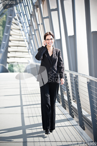 Image of Hispanic businesswoman on the phone