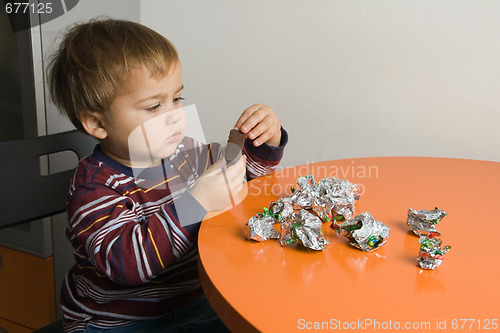 Image of Boy eating chocolates