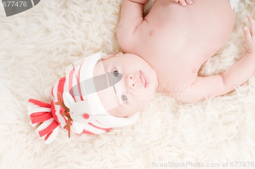 Image of Newborn baby in chritstmas hat