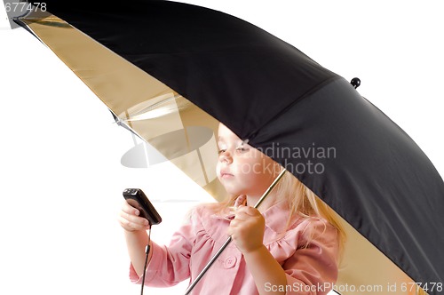 Image of Little girl talking on the phone