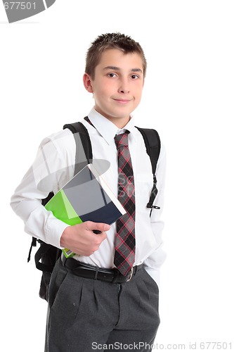 Image of Schoolboy with books and backpack