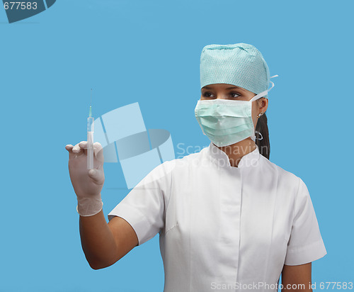 Image of Female nurse holding a syringe