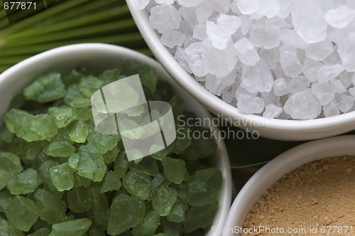 Image of bath salt and palm leaf