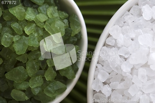 Image of bath salt and palm leaf