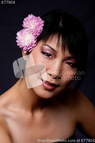 Image of Face of Asian woman with flowers