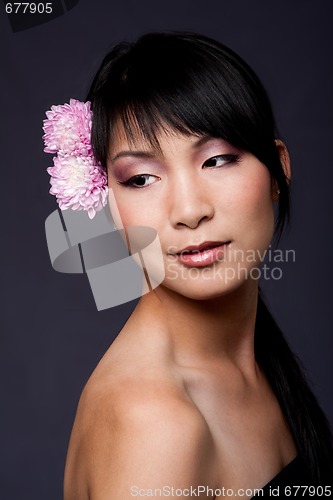 Image of Face of Asian woman with flowers