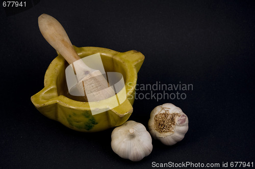 Image of Mortar with garlic.