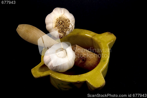 Image of Mortar with garlic.