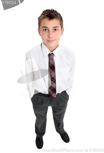 Image of Typical school boy stands in uniform