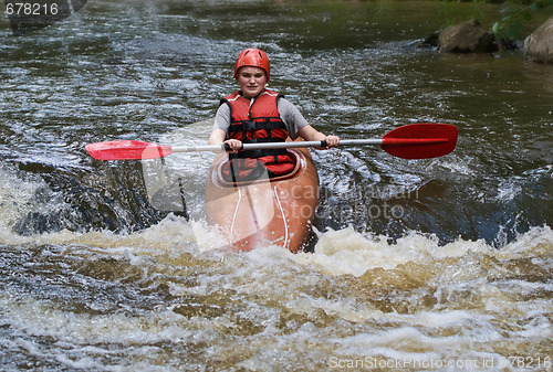 Image of teenage girl white water kayaking
