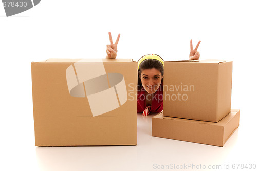 Image of Happy woman behind the boxes