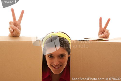 Image of Happy woman behind the boxes