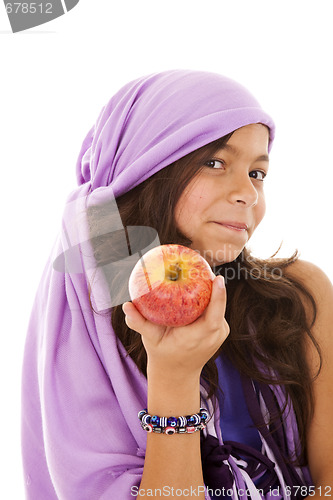 Image of young child showing a red apple