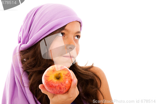 Image of young child showing a red apple