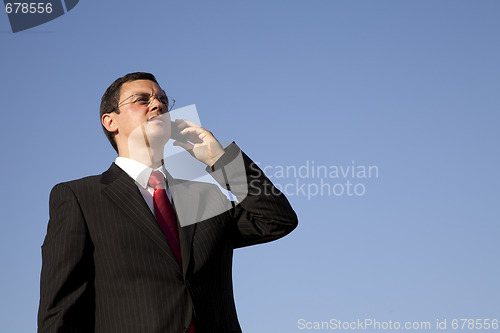 Image of Businessman talking on the cellphone