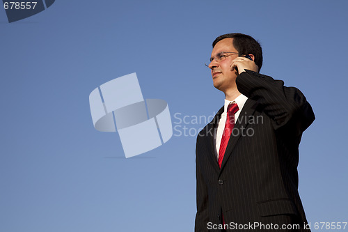 Image of Businessman talking on the cellphone