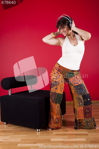 Image of Woman listen music at her house