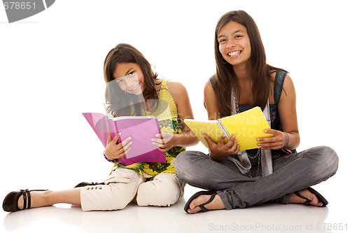 Image of two young student sisters