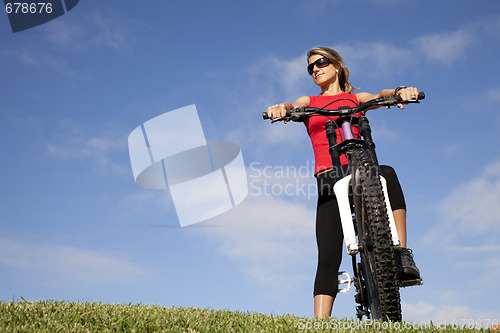 Image of woman having fun on a bicycle