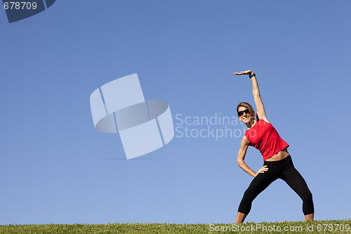 Image of woman doing exercise outdoor