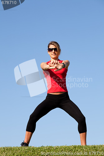 Image of woman doing exercise outdoor